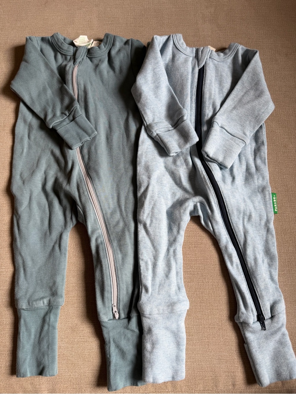 Parade Organics 0-3mo One-Piece Footies in light and dark blue